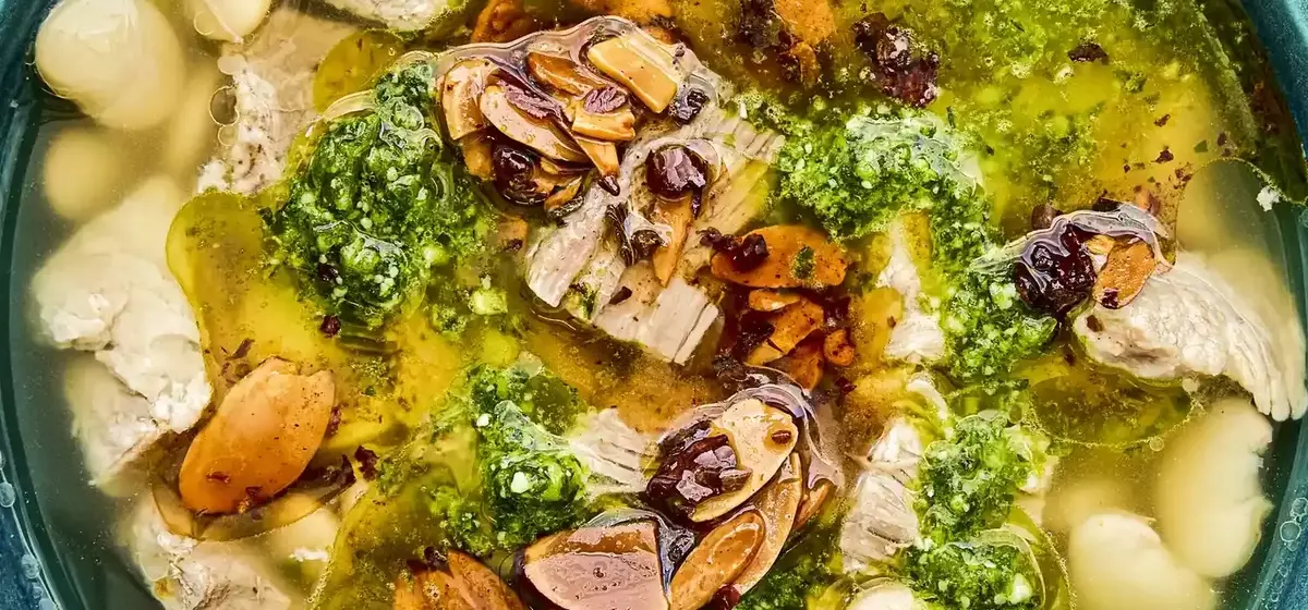 Mexican Brothy Beans with Pork, Salsa Macha, and Cilantro Pesto