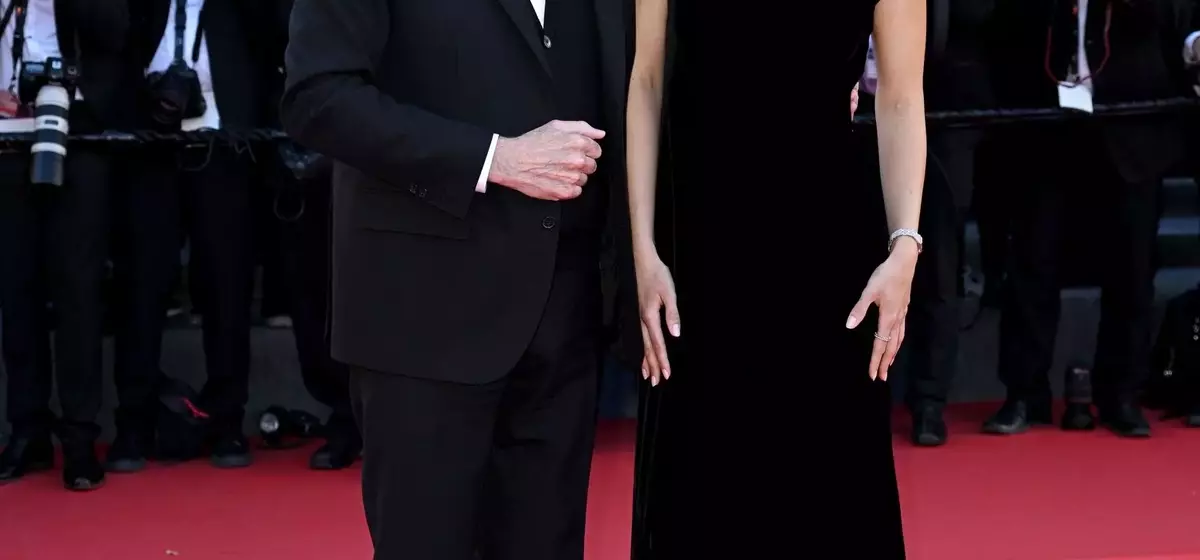 John Travolta's Cannes Style Evolution: From Acting Icon to Beret-Clad Director