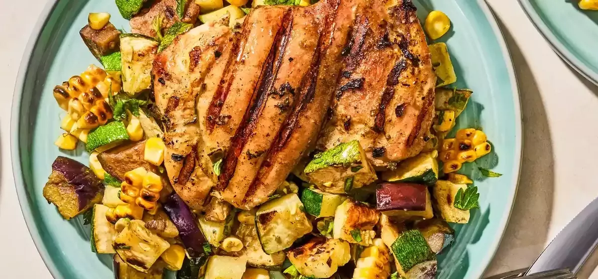 Flavorful Herb-Marinated Chicken Thighs with Grilled Vegetable Medley