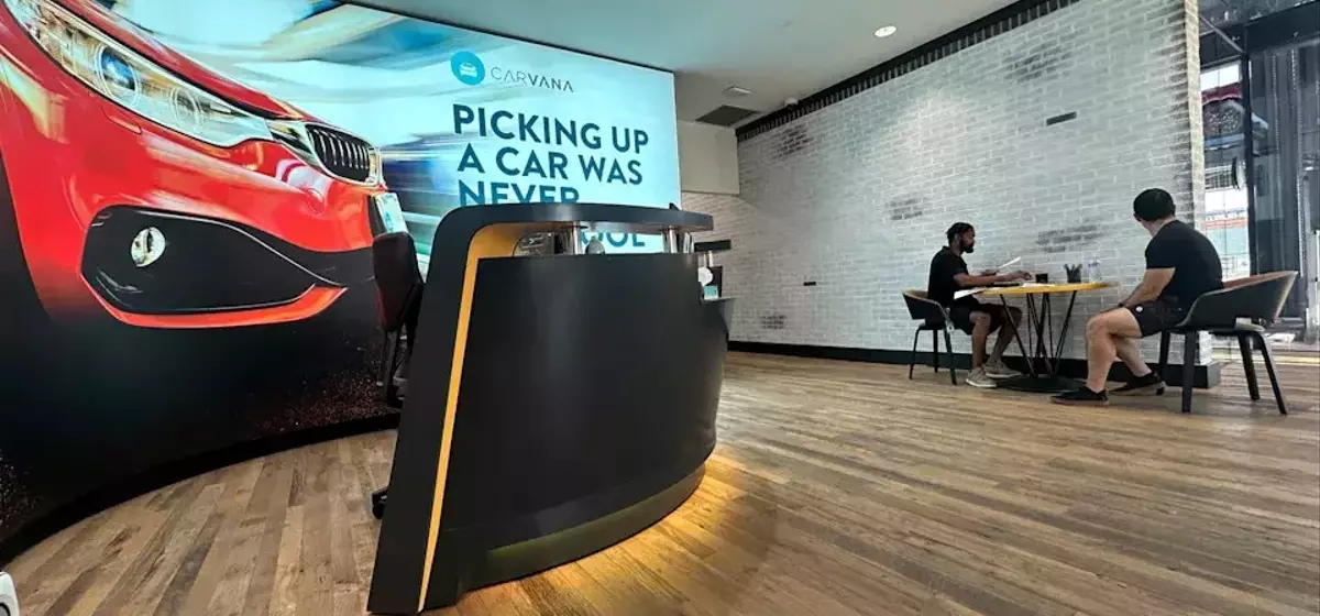 Carvana's Stock Dips Despite Record Quarter Amidst Disappointing Future Projections