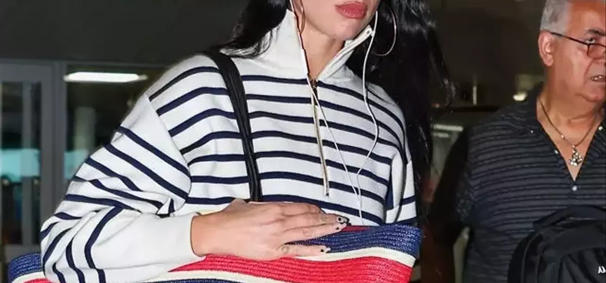 Dua Lipa Redefines Airport Chic with Oversized Chanel Tote