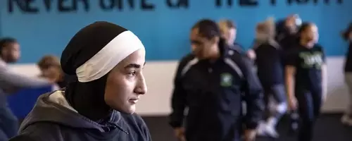 Sisters Revolutionize Women's Wrestling with Faith-Based Uniforms