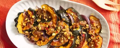 Culinary Harmony: Roasted Acorn Squash with Caramelized Red Onions and Honey-Date Vinaigrette