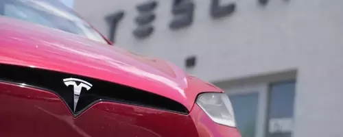 Tesla's Shifting Strategy: From EV Leader to AI and Robotics Pioneer Amidst Profit Slump