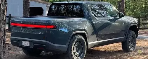 Rivian R1T's Quirky Feature: 'Carolina Squat' Achieved Through Camp Mode