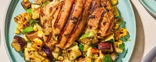 Flavorful Herb-Marinated Chicken Thighs with Grilled Vegetable Medley