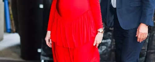 Anne Hathaway's Bold Maternity Style Debut in Red