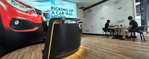 Carvana's Stock Dips Despite Record Quarter Amidst Disappointing Future Projections