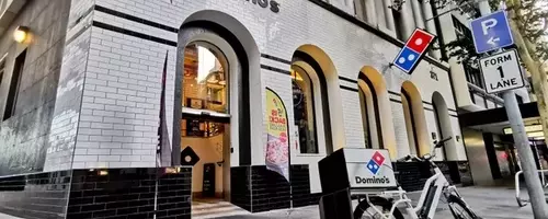 Domino's Pizza Faces Significant Challenges, Downgraded to 'Sell'